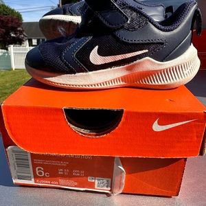 Size 6 infant / toddler Navy and white Nike Downshifters